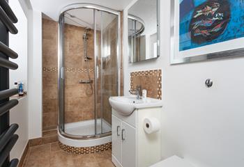 Wash off the sand in the modern bathroom and get ready for an evening stroll as the sun comes down.