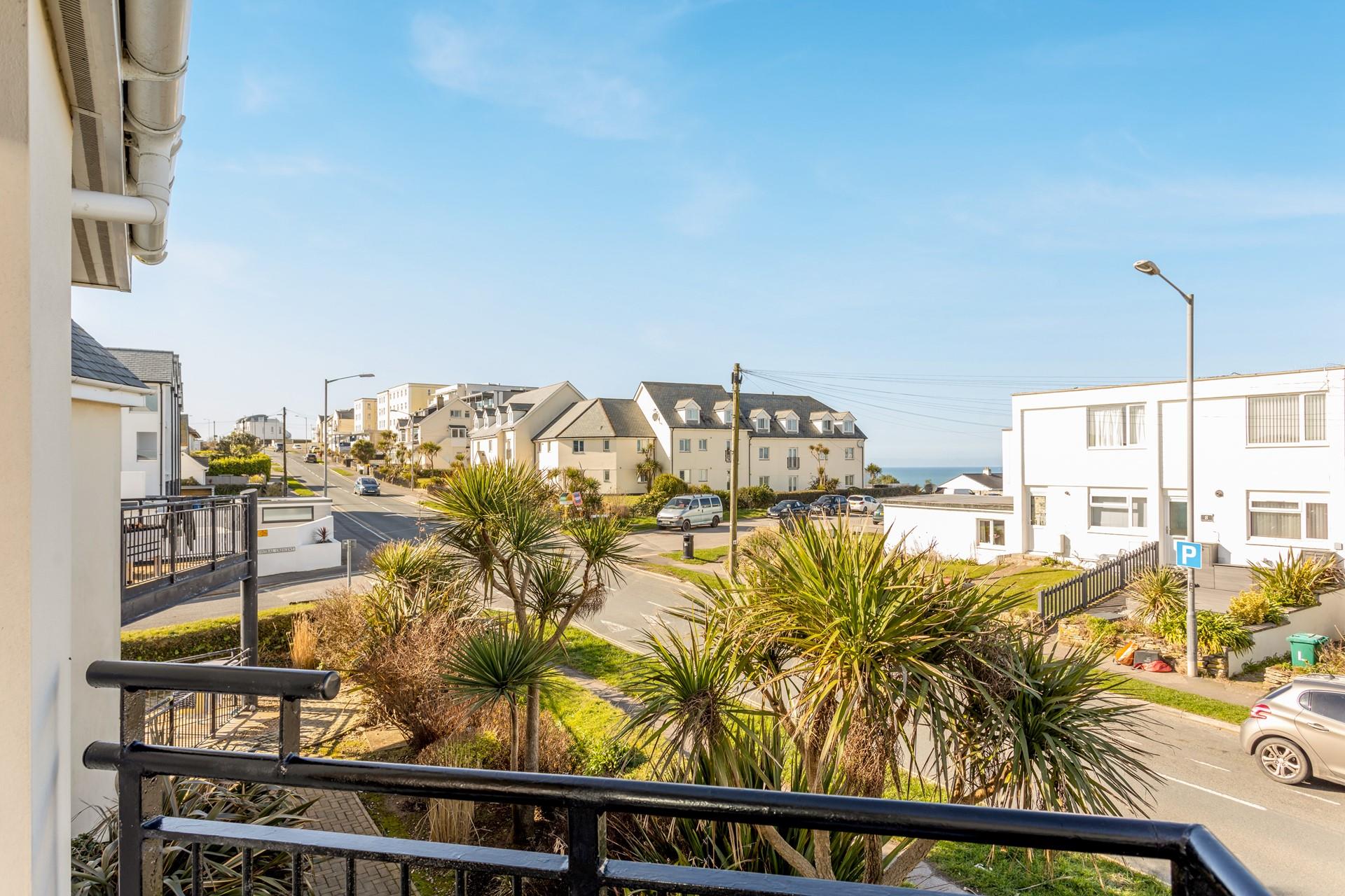 You can catch a glimpse of the sea from the balcony.