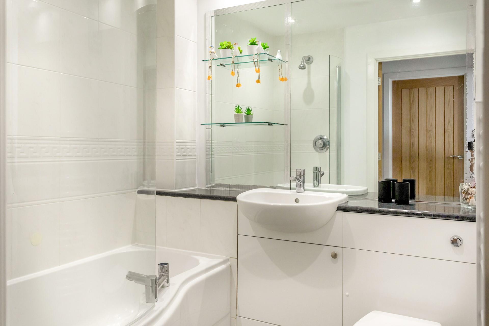 Enjoy a long soak or simply a quick rinse in the family bathroom. 