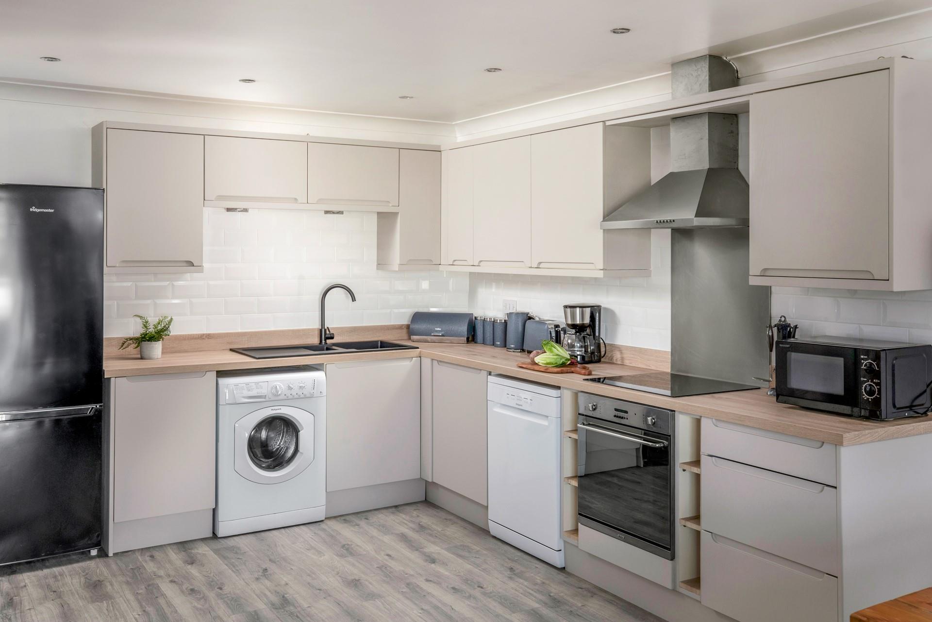 The kitchen has all you need for cooking a family feast, or simply dish up a takeaway!