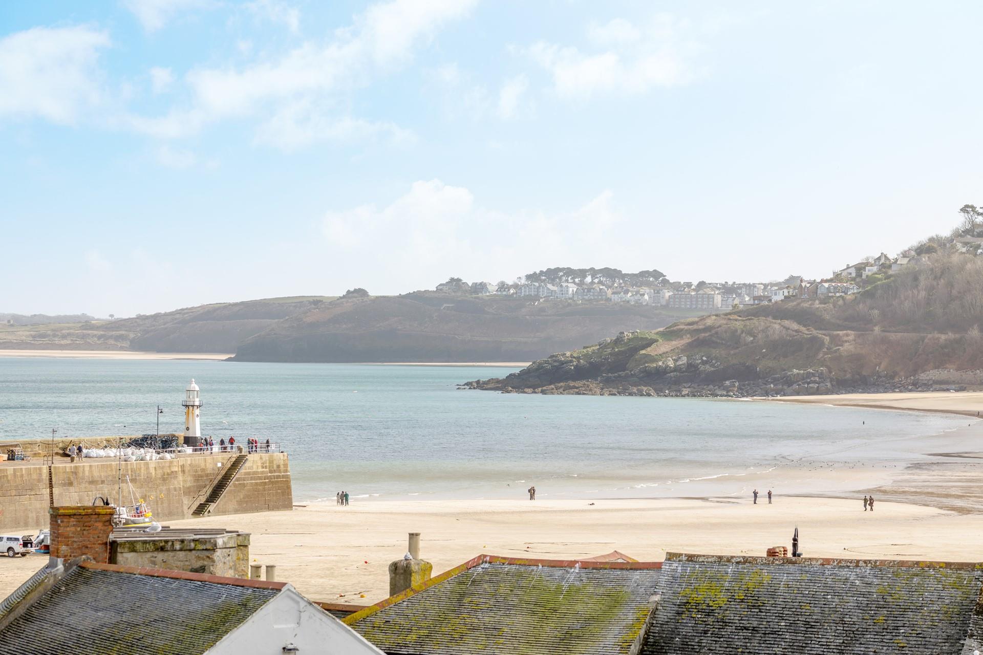 Enjoy sea views across the harbour from the double bedroom.