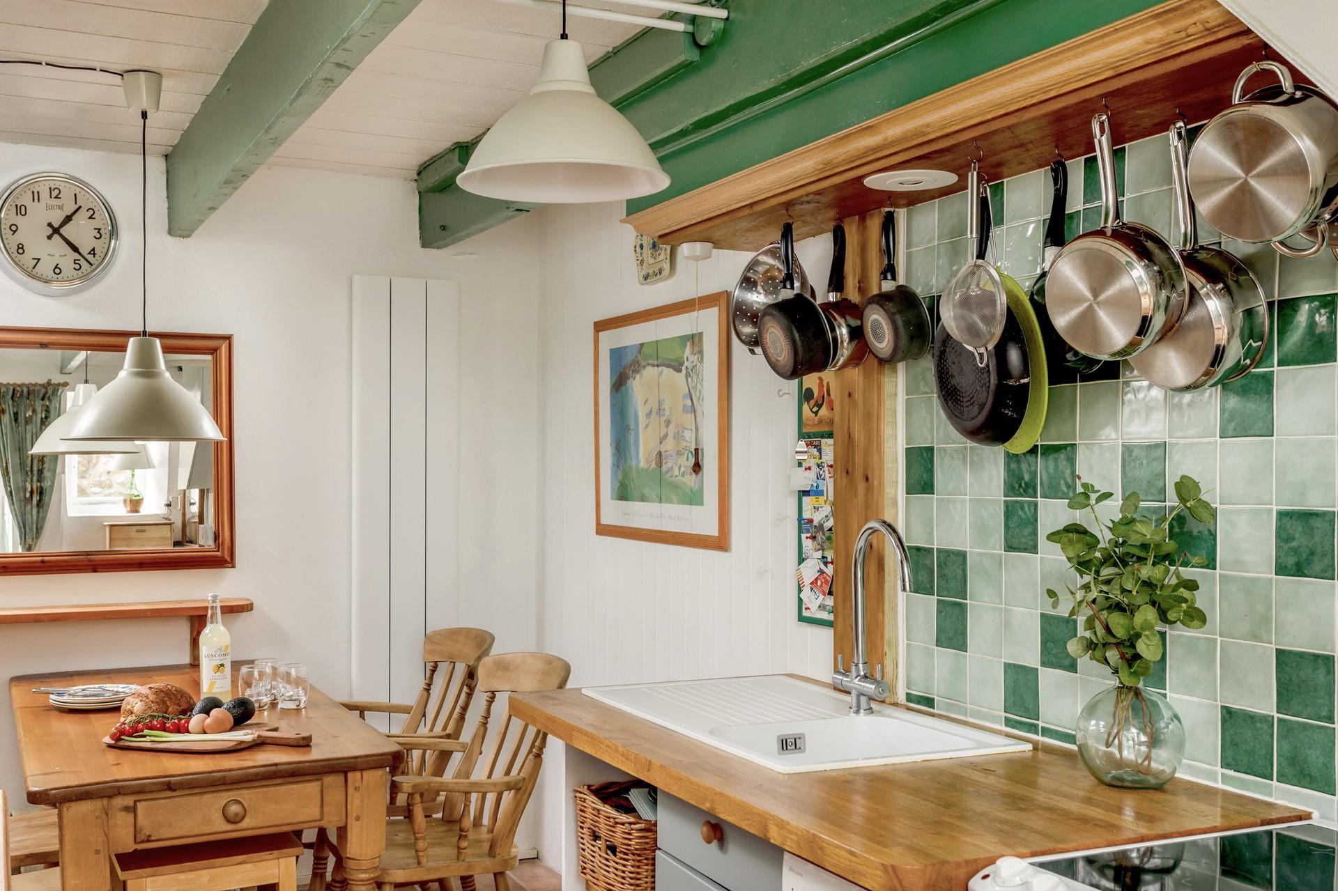 Sit around the country style dining table and enjoy a meal together.