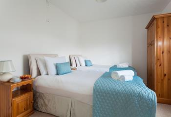 Bedroom 2 has calming blue tones to reflect the close proximity to the sea.