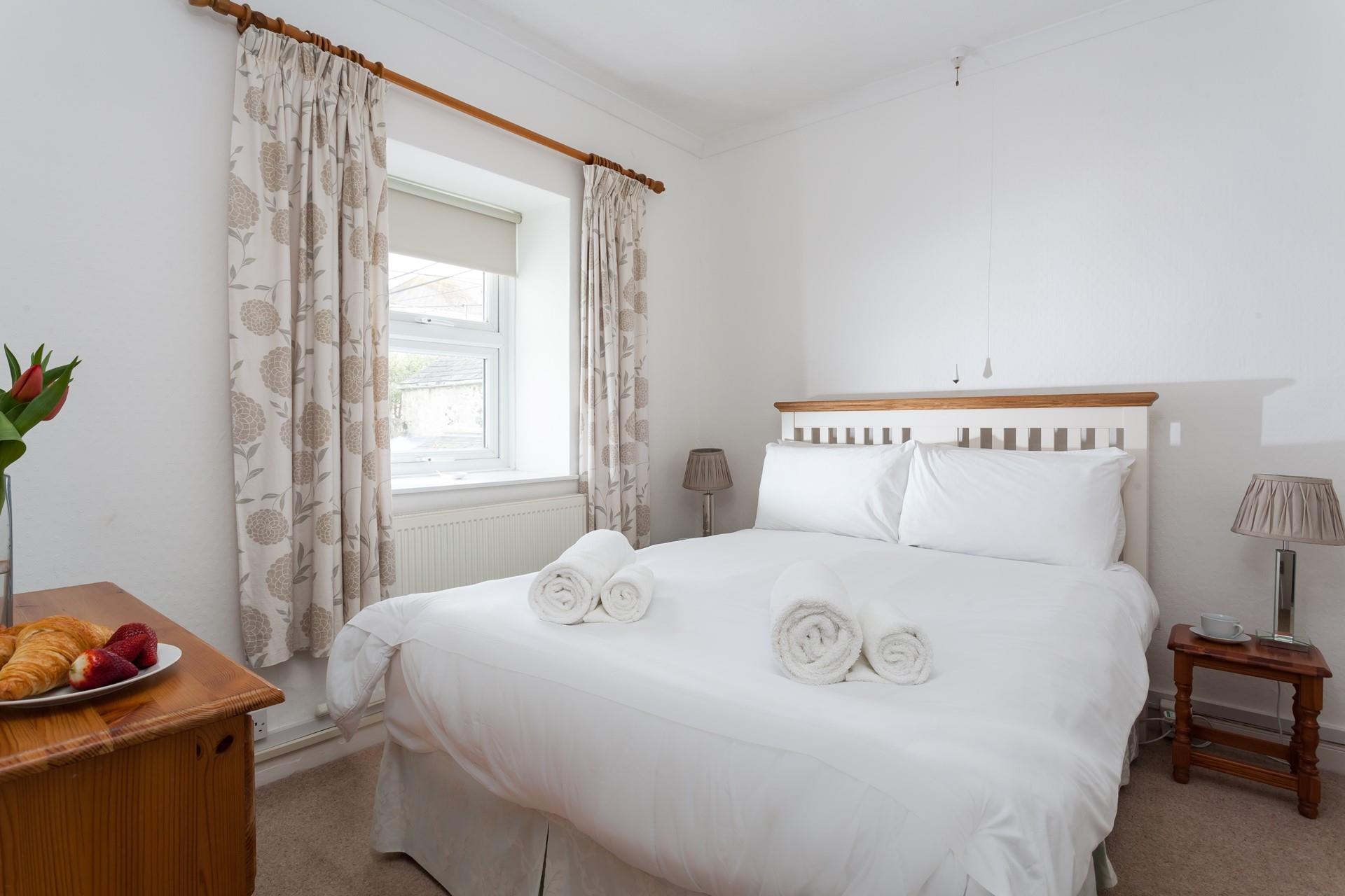 Sink into the soft sheets in the double bed for a restful night's sleep.