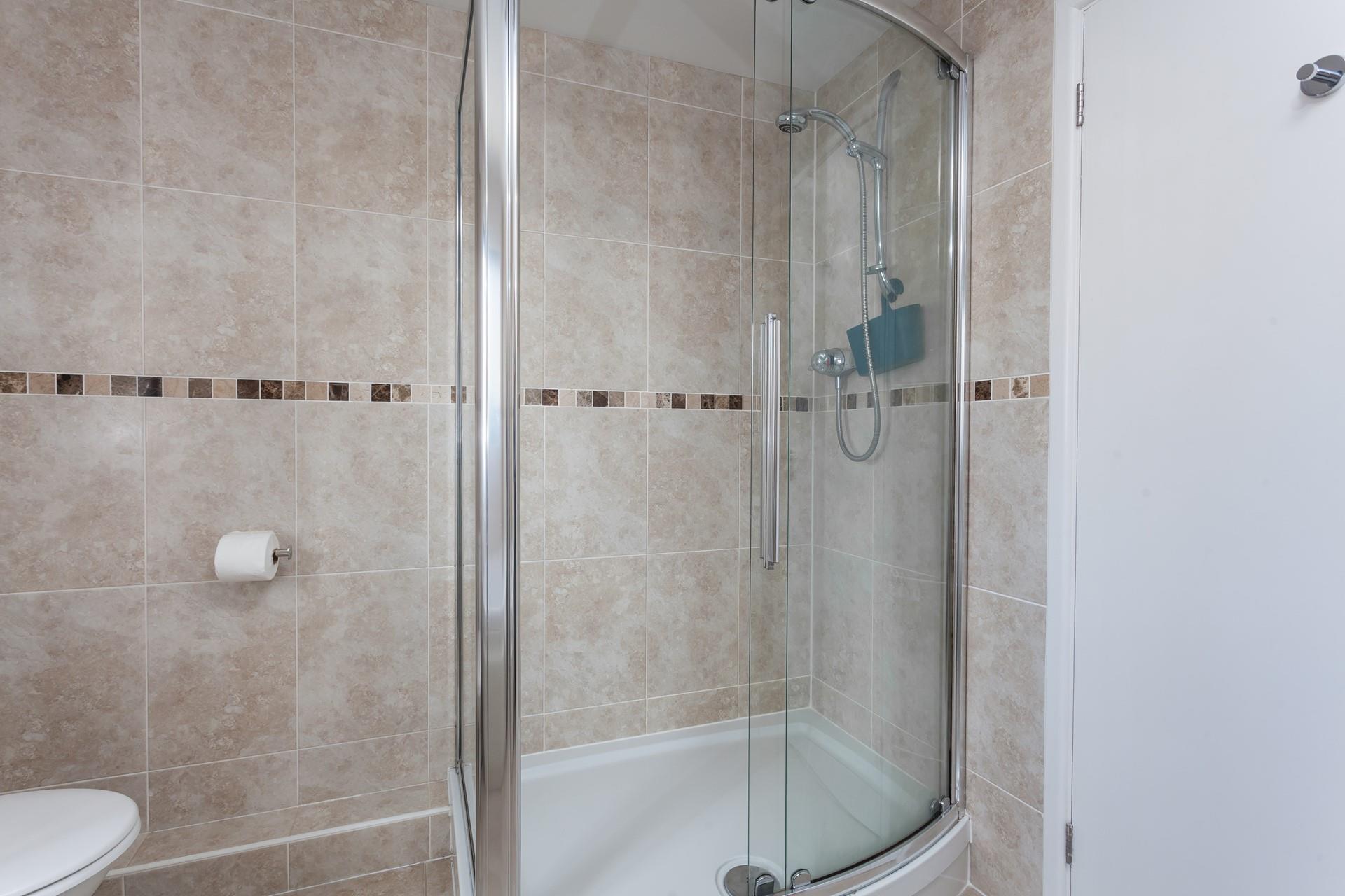 Wash off your sandy toes in the shower after a day on the beach.