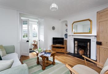 The cottage blends traditional and modern features with the Victorian fireplace.