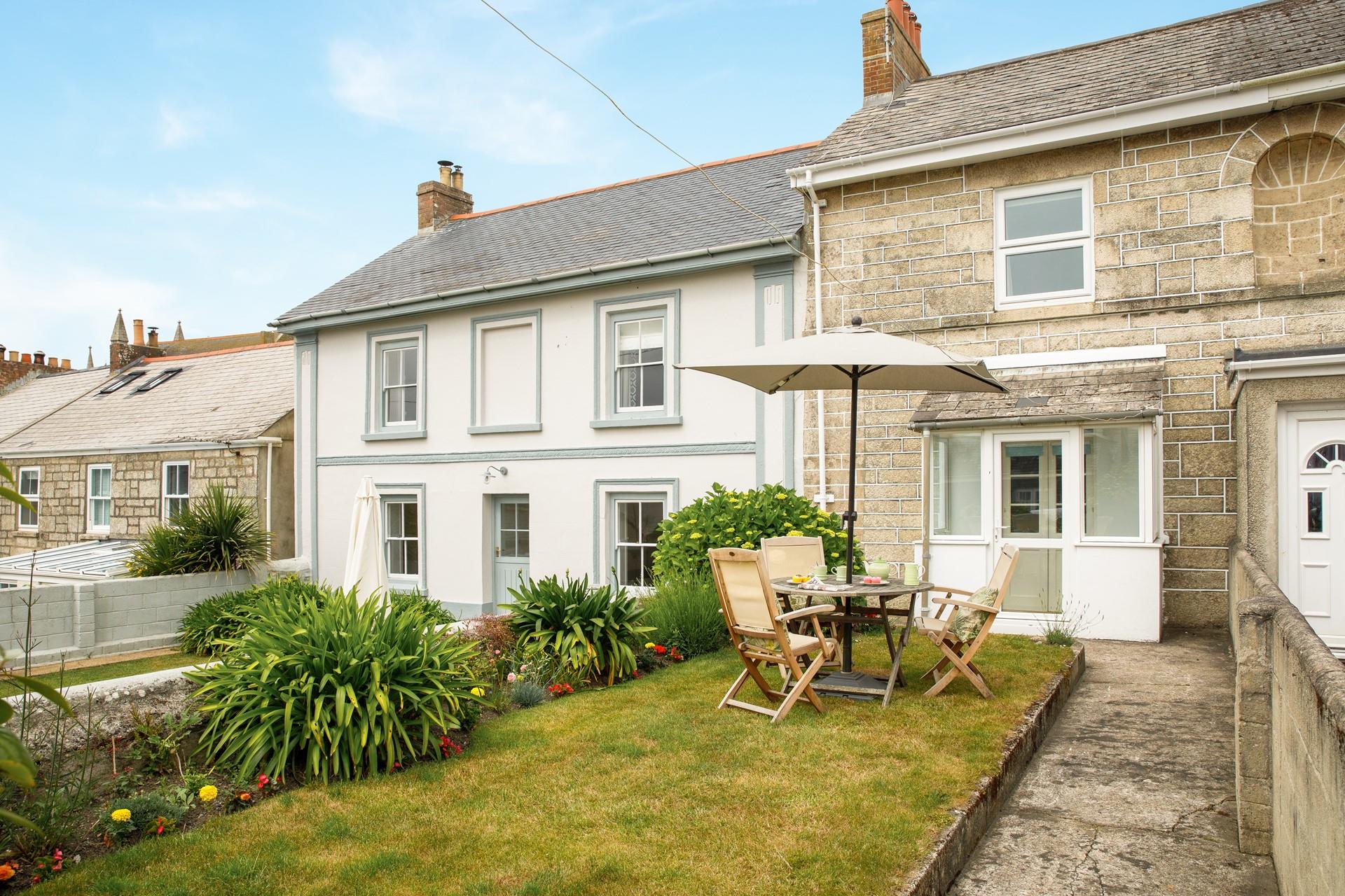 Soak up the sun in the pretty garden.