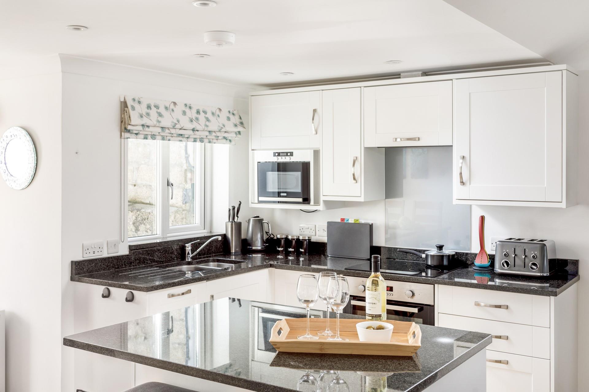 The kitchen is modern and well-equipped to cook hearty breakfasts and tasty dinners.