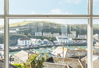 Watch the idyllic scene of the boats bobbing in the harbour from the window.