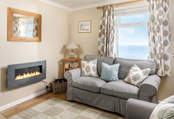 Snuggle up with the flame effect fire on a cosy evening.