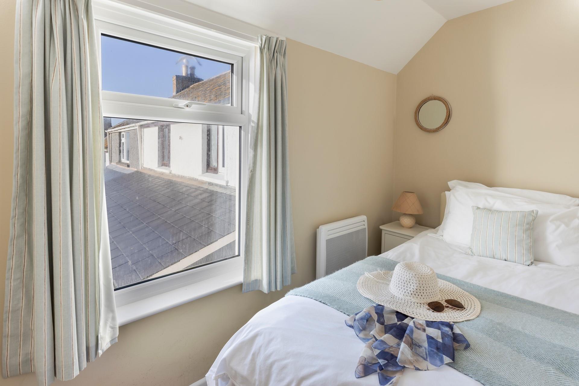 A cosy single bed offers a peaceful night's sleep by the sea!