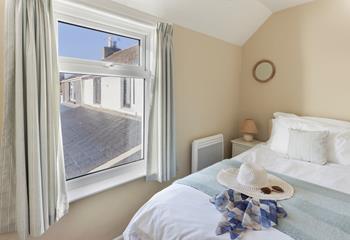 A cosy single bed offers a peaceful night's sleep by the sea!
