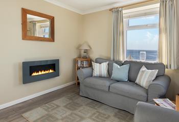 Snuggle up with the flame effect fire on a cosy evening.