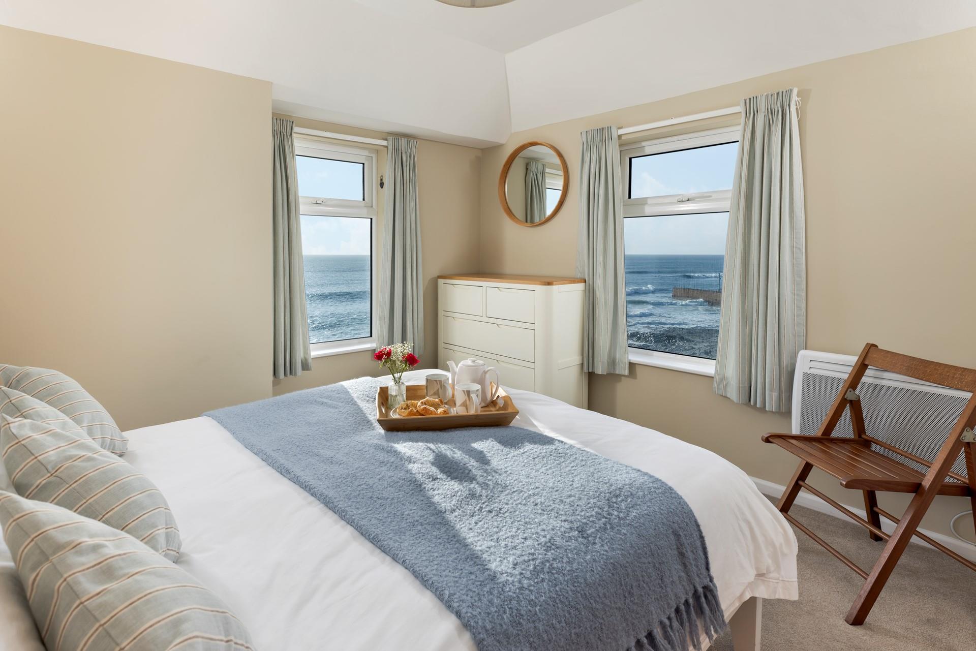 Wake up and enjoy sea views from Bedroom 1.