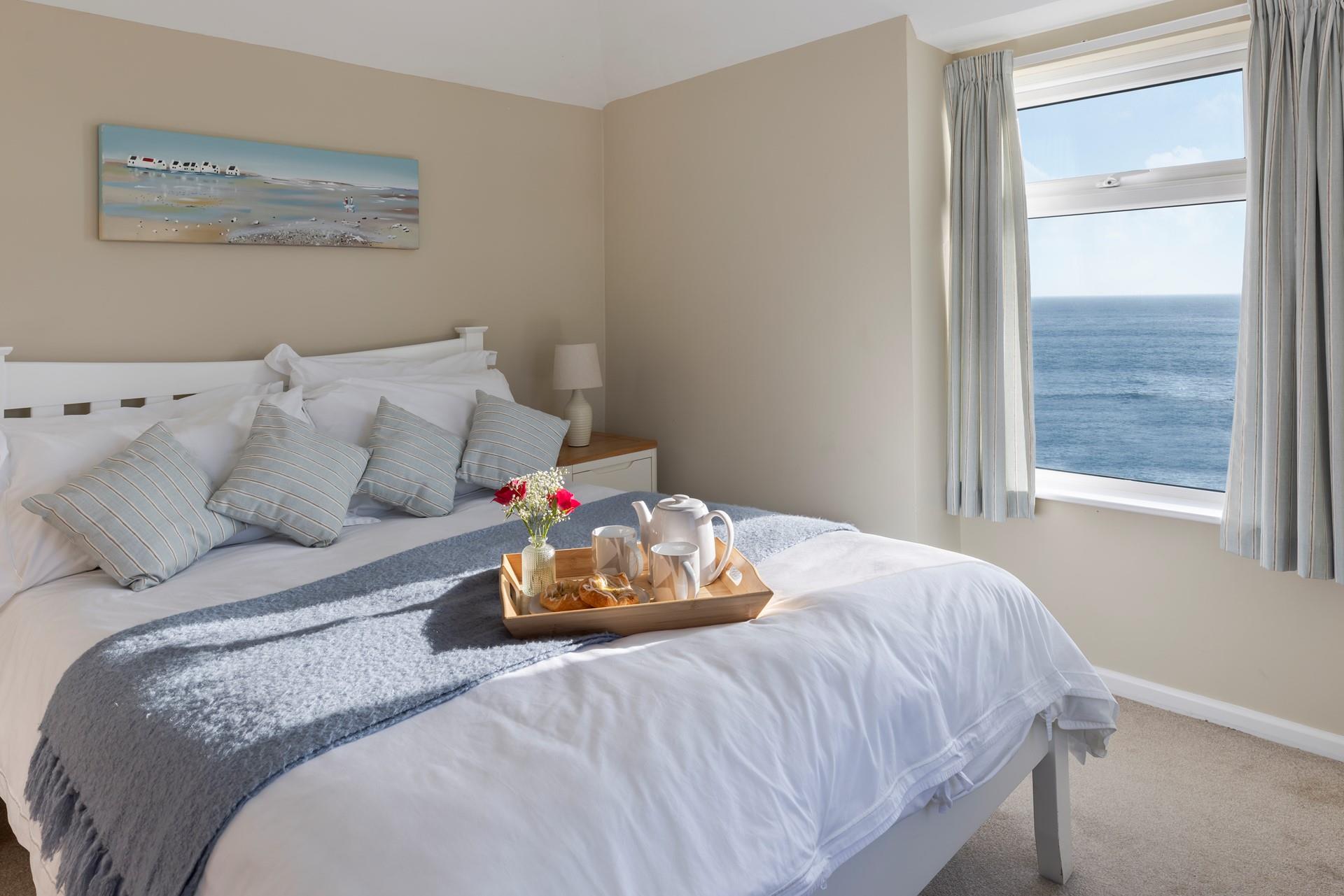 Spend slow mornings in bed, watching the waves ebb and flow.