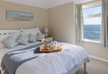 Spend slow mornings in bed, watching the waves ebb and flow.