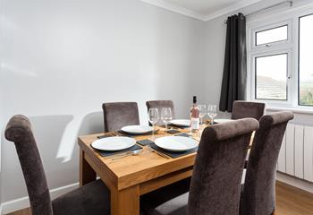 Tuck into a tasty meal with the family around you in the dining room.