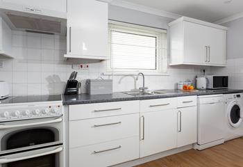 The modern, well-equipped kitchen is ideal for cooking family favourite meals.