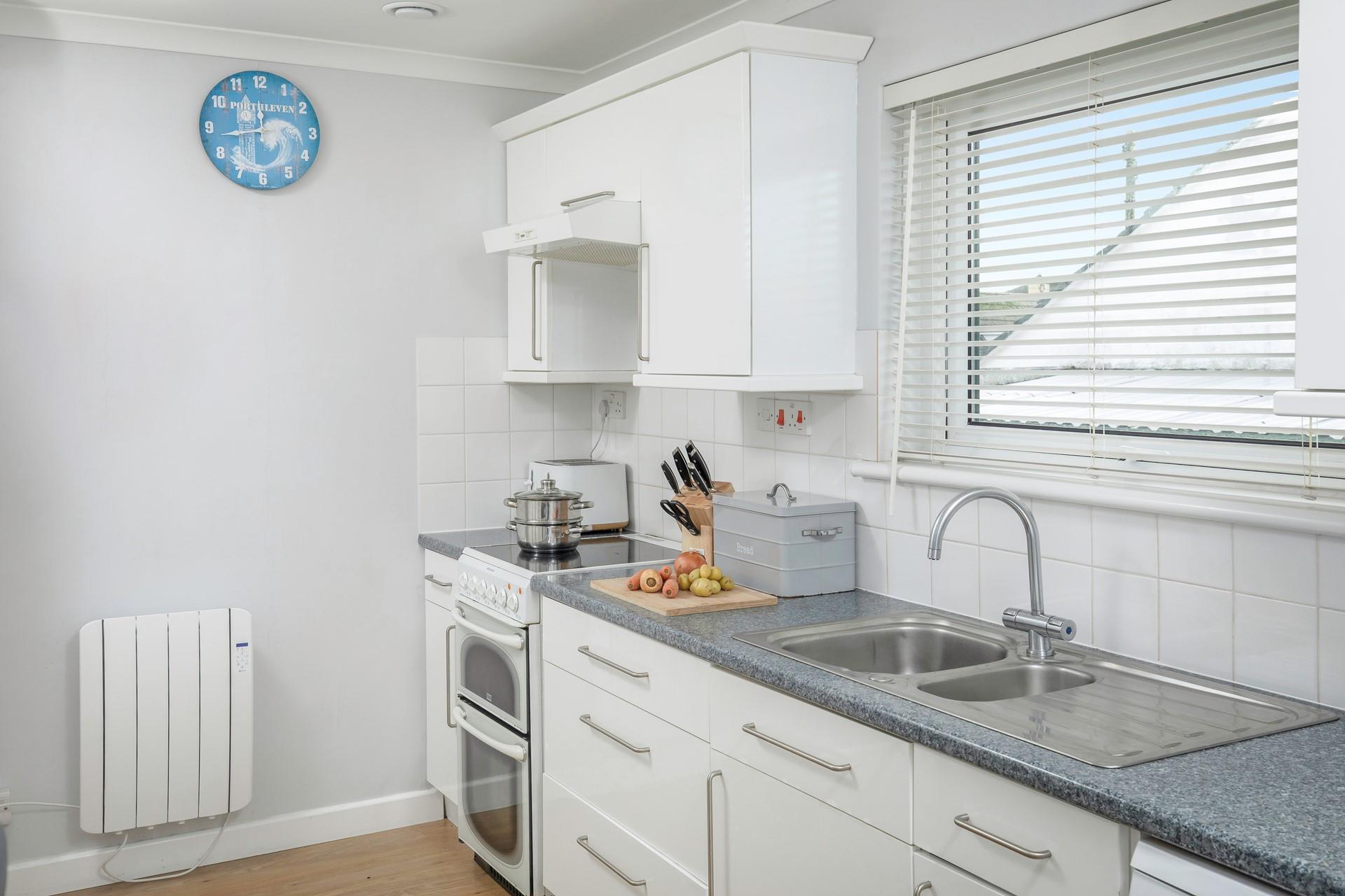 The modern, well-equipped kitchen is ideal for cooking family favourite meals.