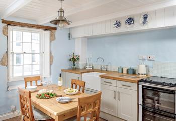 The country-style kitchen is modern and well-equipped for cooking delicious meals.