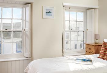 The two sash windows allow for the bedroom to be bright and airy.