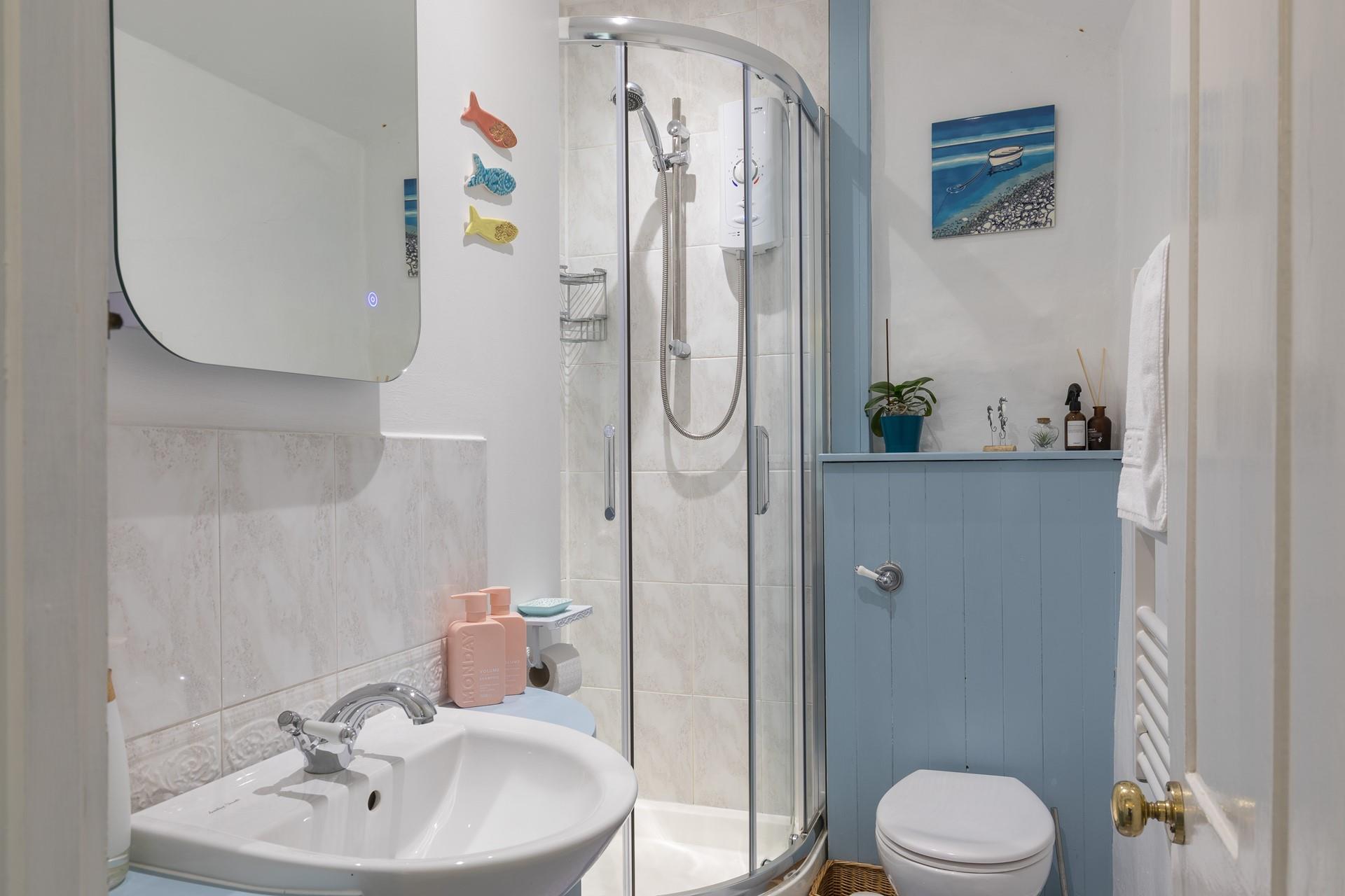 Wash off your sandy toes in the shower after a day on Porthleven beach.