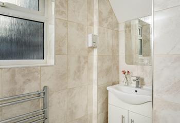 The shower room has a heated towel rail for the luxury of warm fluffy towels after a morning shower.