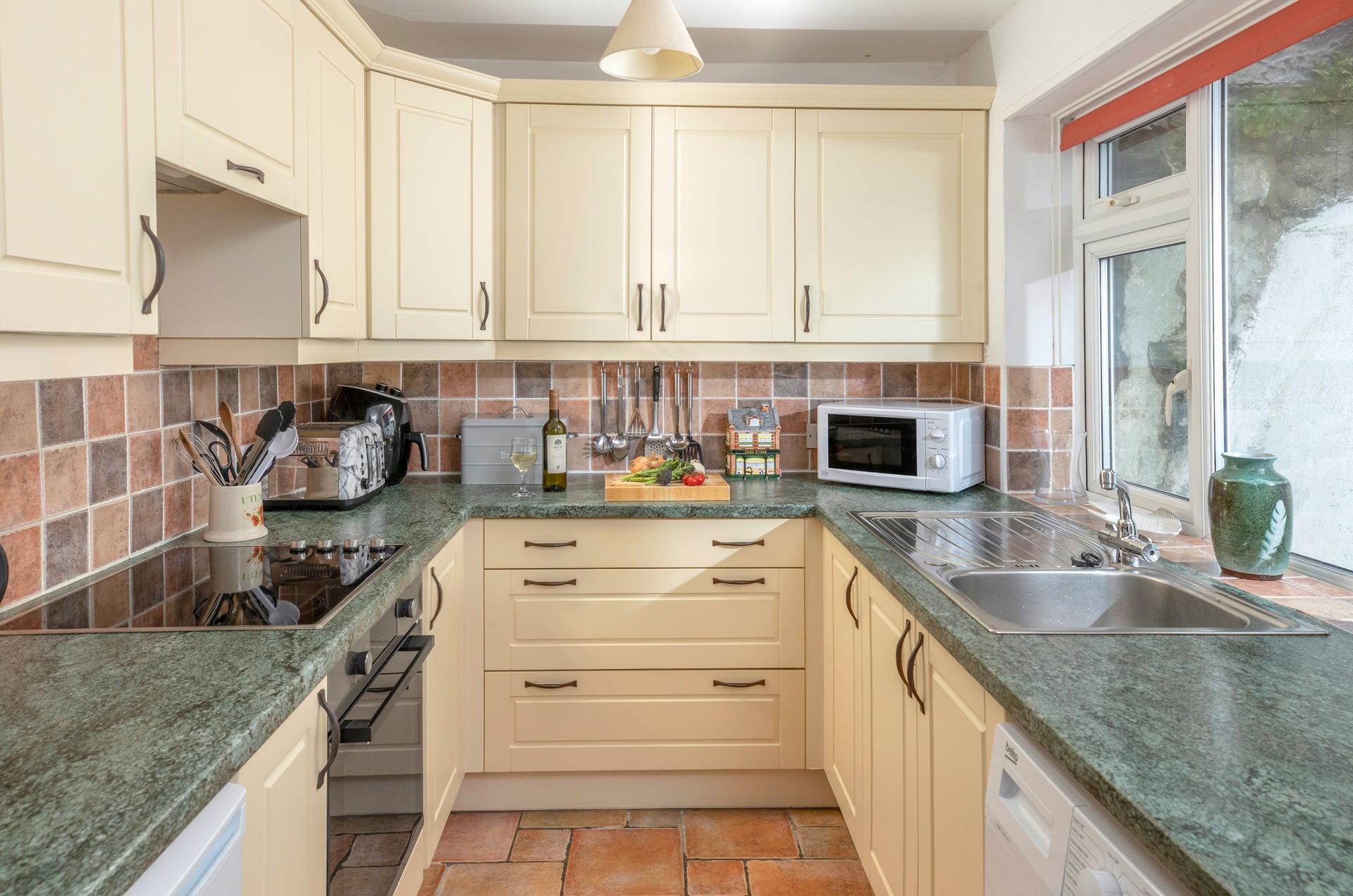 The kitchen is modern and well-equipped.