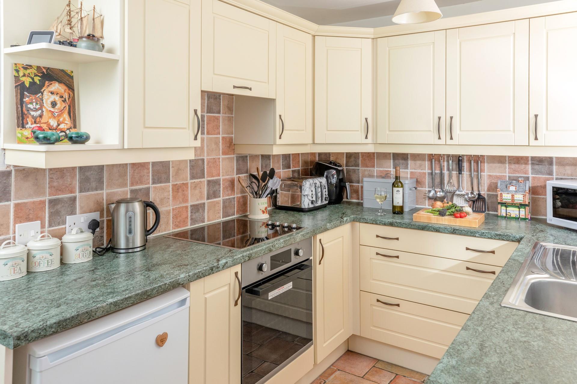 The kitchen is fully equipped to rustle up tasty meals.