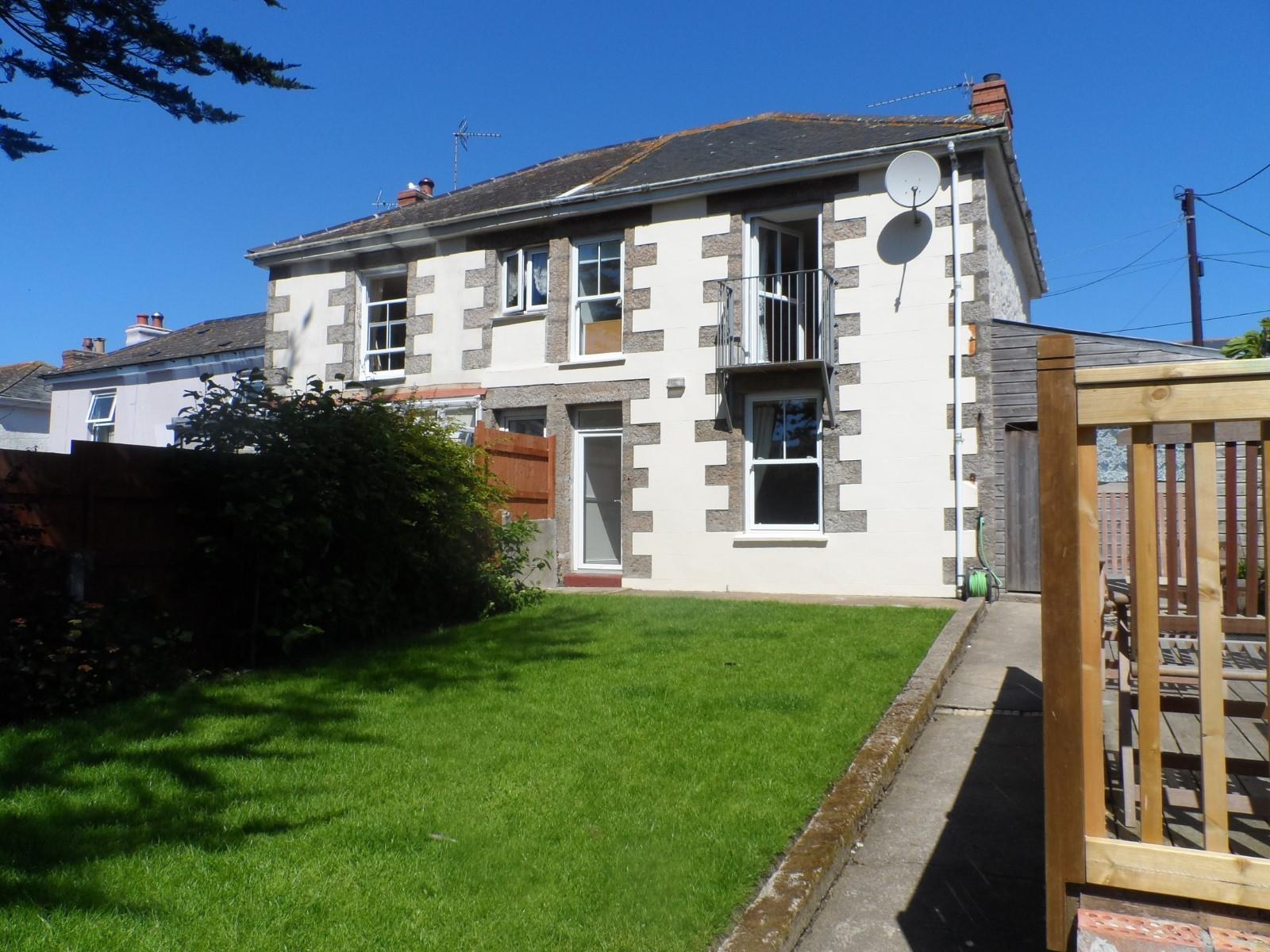Watch the children and furry friends play in the lawned garden.