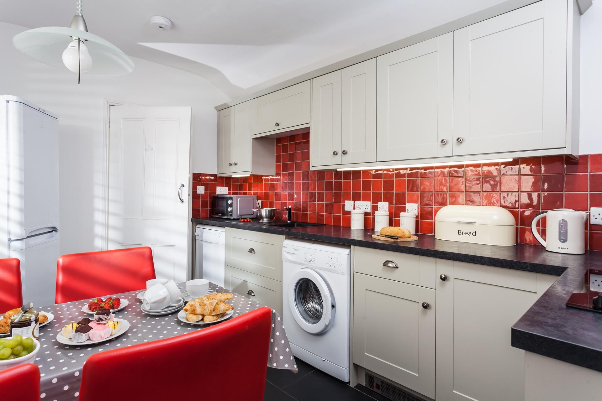 Red adds a splash of colour to the modern kitchen.