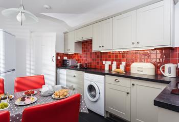 Red adds a splash of colour to the modern kitchen.