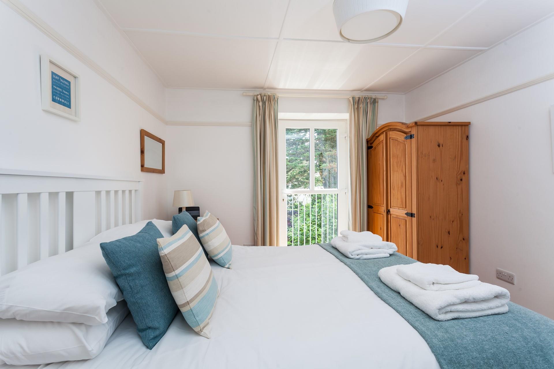 Relax in the spacious double bed after spending the day walking the coast path and exploring Praa Sands.