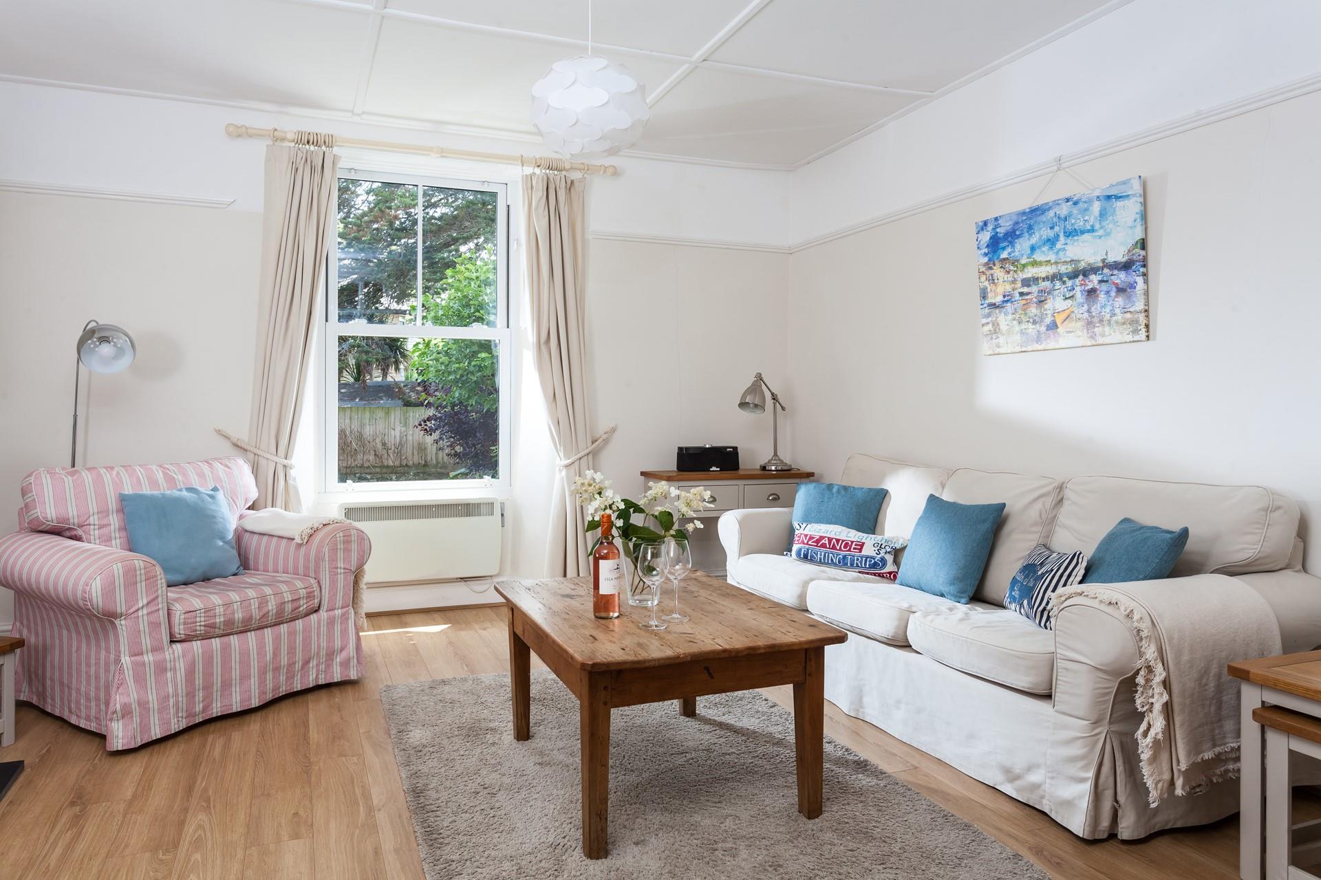 The comfortable sitting room is a space to unwind after a day of exploring the area.
