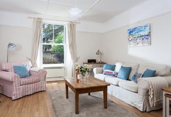 The comfortable sitting room is a space to unwind after a day of exploring the area.