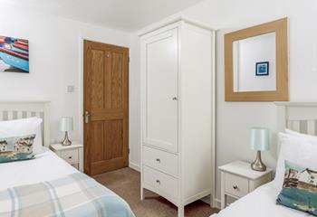 Bedroom 2 has twin beds and lovely furnishings.