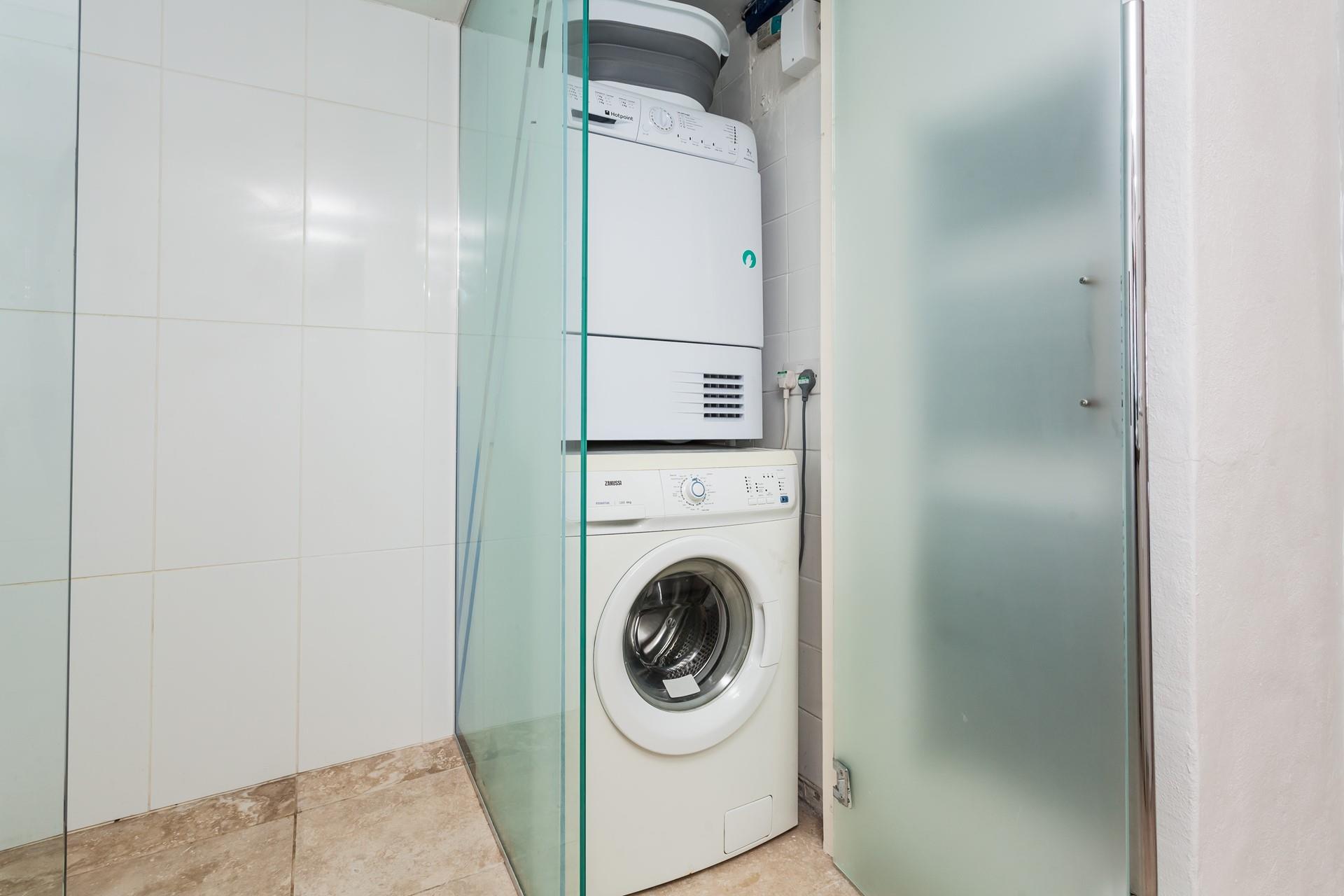 There is a tumble dryer and washing machine available for use in the property.