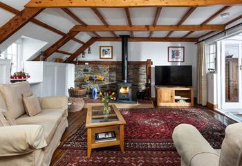 Snuggle up in the cosy sitting room in front of the woodburner on chilly evenings.