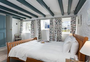 Soft sheets and fluffy white towels await you in bedroom 1.