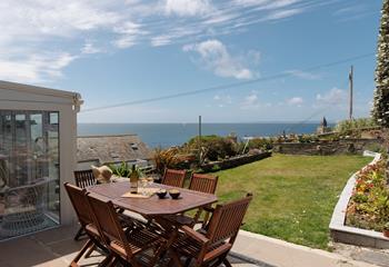 Sip a glass of something cold and enjoy the sea view.