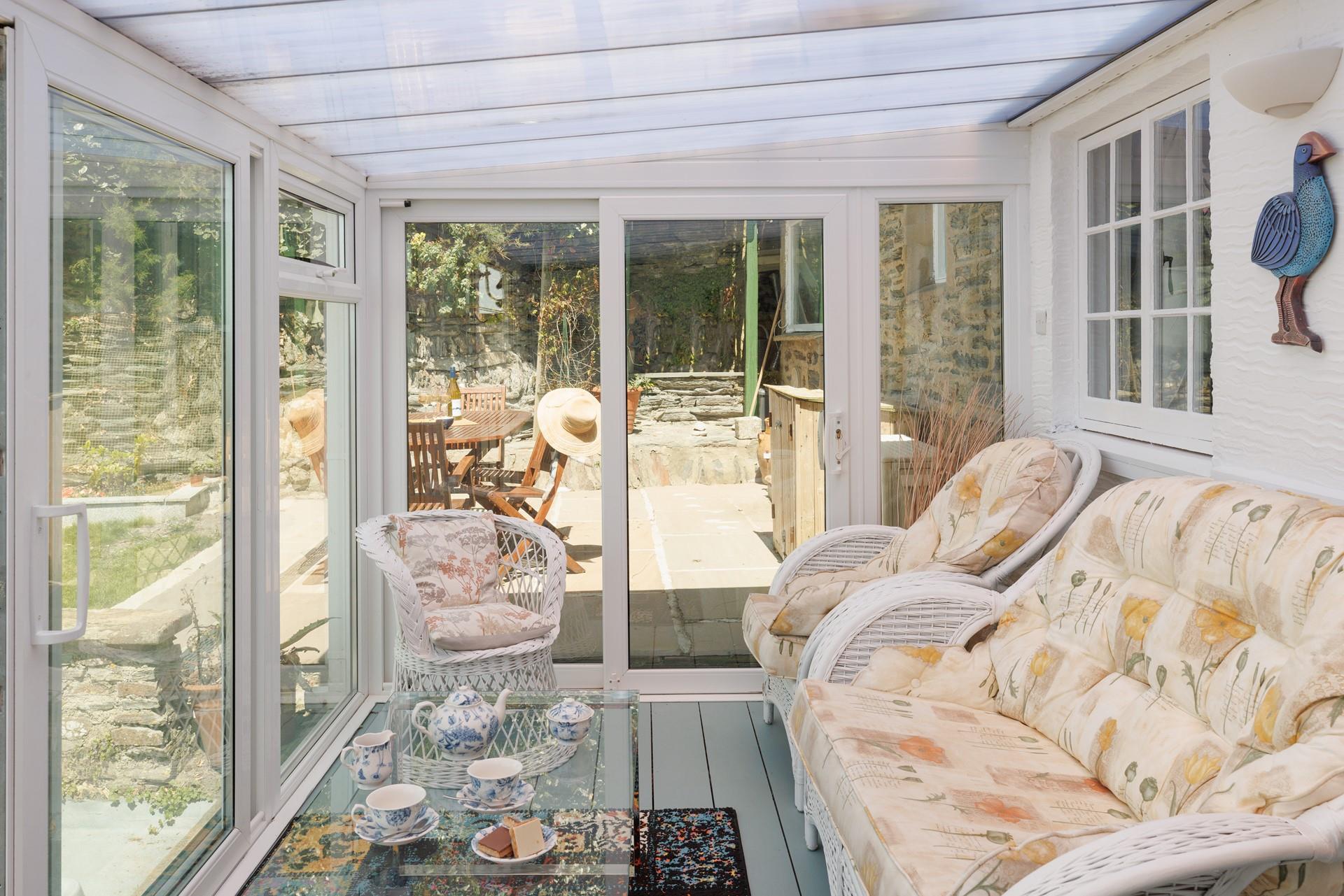 The sunroom has beautiful views across the Bay to enjoy while sipping an afternoon tea.