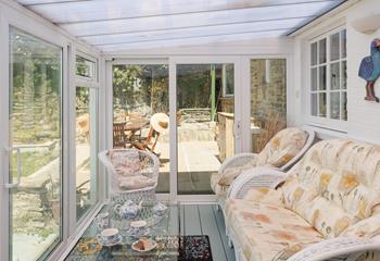 The sunroom has beautiful views across the Bay to enjoy while sipping an afternoon tea.