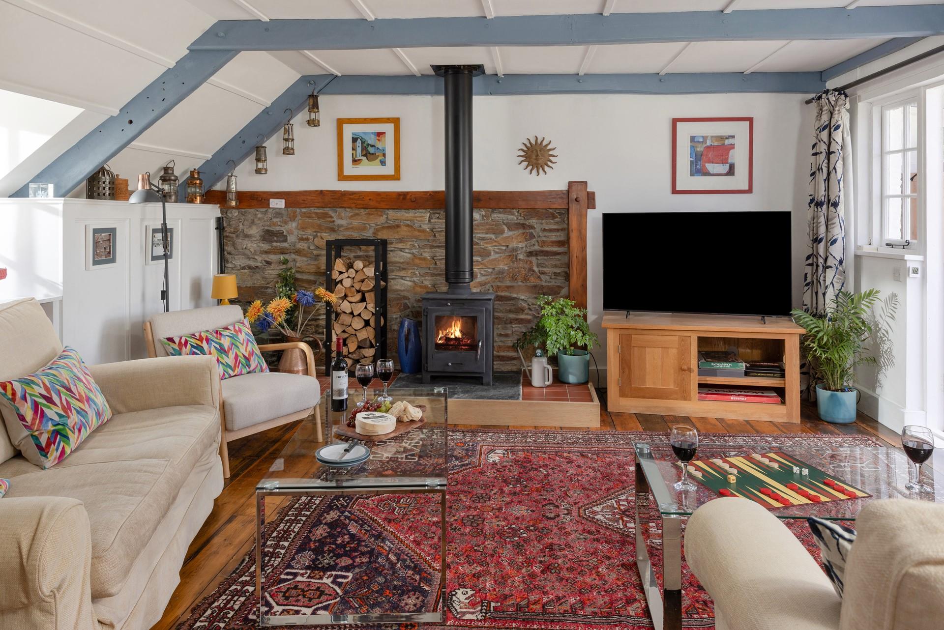 Snuggle up in the cosy sitting room in front of the woodburner on chilly evenings.