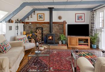 Snuggle up in the cosy sitting room in front of the woodburner on chilly evenings.
