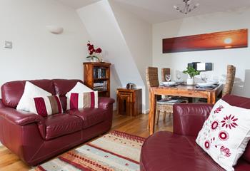 The sitting room is filled with homely touches such as the artwork and furnishings.