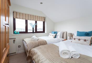 Bedroom 2 has twin beds, perfect for adults or children.