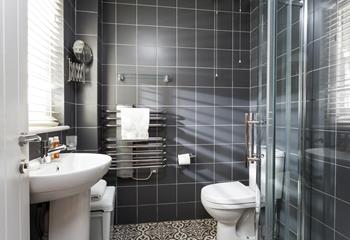 The stylish en suite offers an invigorating morning shower.