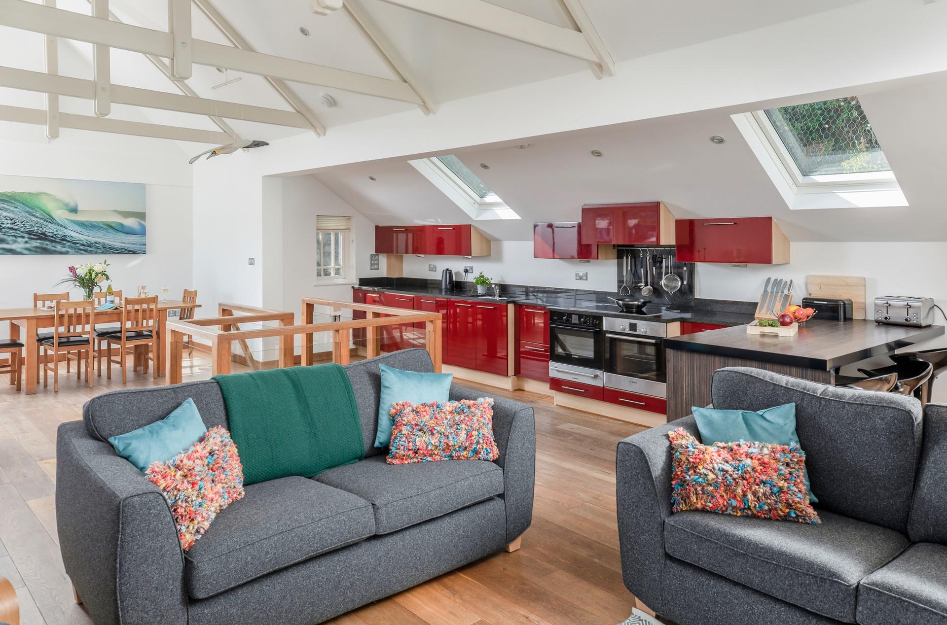 The sitting room offers stunning views of the harbour you can enjoy the day to night.