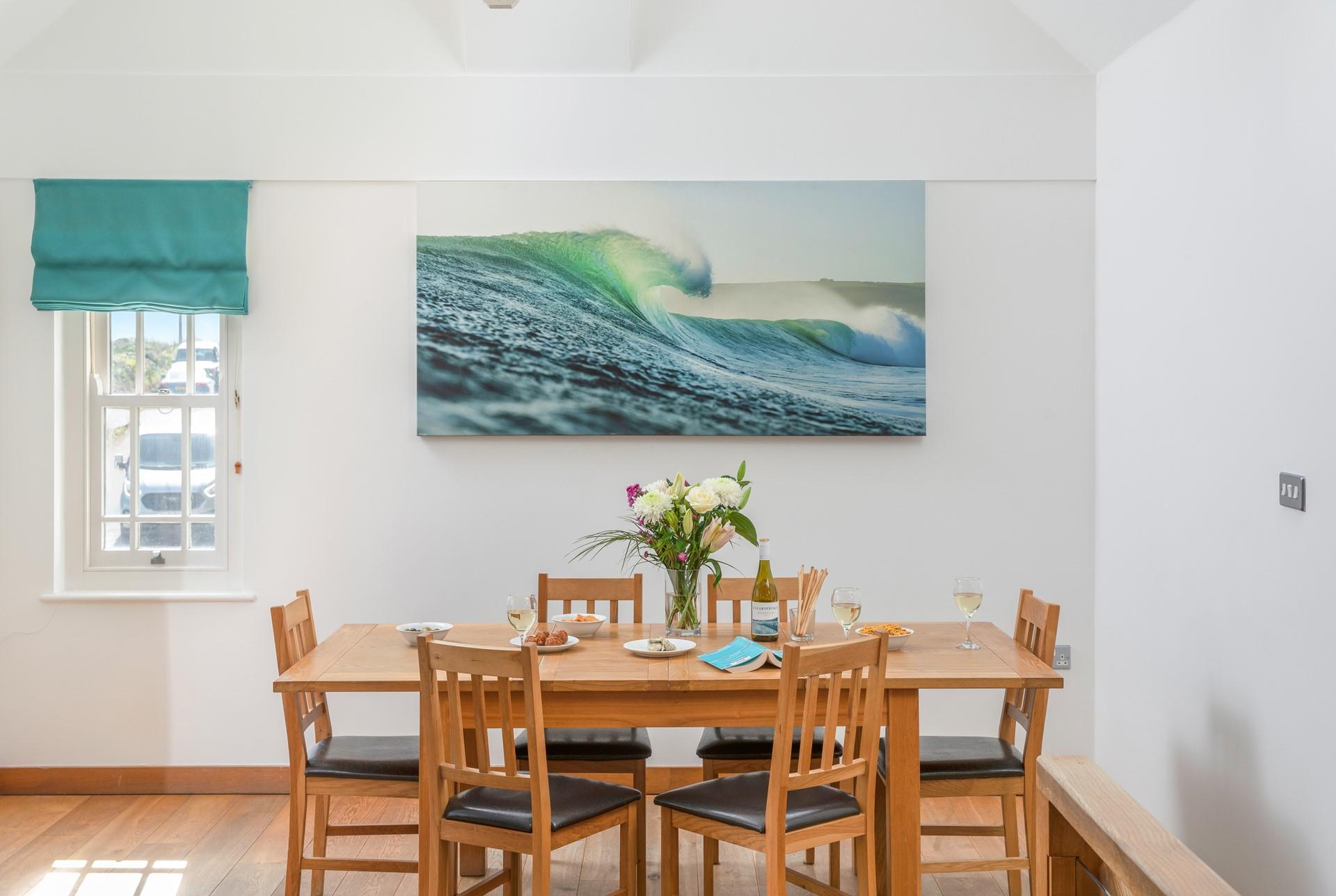 The ocean-inspired artwork and decor reflect the seaside location.
