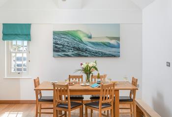 The ocean-inspired artwork and decor reflect the seaside location.